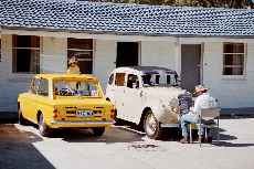 YJ washing the Imp, while Peter Tav applies his badge